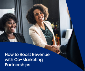 A businesswoman smiles and shakes hands with a co-marketing partner